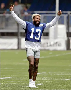  ?? AP Photo/Seth Wenig ?? ■ New York Giants’ Odell Beckham Jr. gestures after practice Aug. 7 Rutherford, N.J. Beckham Jr. is now the NFL’s highest-paid wide receiver.in East