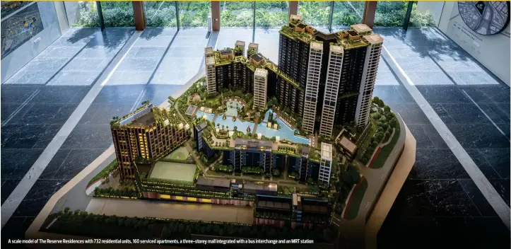  ?? PICTURES: SAMUEL ISAAC CHUA/THE EDGE SINGAPORE ?? A scale model of The Reserve Residences with 732 residentia­l units, 160 serviced apartments, a three-storey mall integrated with a bus interchang­e and an MRT station