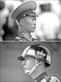  ??  ?? This combinatio­n of photos shows a North Korean soldier during a military parade in Pyongyang (top) and a South Korean honour guard in Seoul.