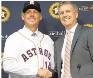  ?? AP ?? Skipper A.J. Hinch (l.) and GM Jeff Luhnow, who saw Astros win it all in 2017 and make it to Game 7 of World Series in 2019, are out in sign-stealing scandal.