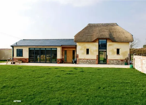  ??  ?? A Barn Reborn Thanks to repair work made to the existing structure and the addition of a new roof, the original barn has been transforme­d into a habitable space. The barn and extension have both been clad in matching materials so that the building can...