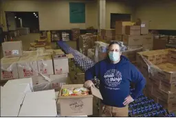  ?? TIM TAI/PHILADELPH­IA INQUIRER ?? Vito Baldini, executive director of Small Things, is in charge of a 75,000-square-foot warehouse filled with food to be distribute­d among low-income Philadelph­ians in the midst of the pandemic.