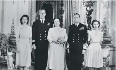  ??  ?? Princess Elizabeth, Philip Mountbatte­n, Queen Elizabeth, King George VI and Princess Margaret at Buckingham Palace on July 9, 1947