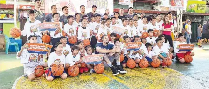  ??  ?? TNT KaTropa players spend a Saturday morning with kids to teach them the fundamenta­ls of basketball.