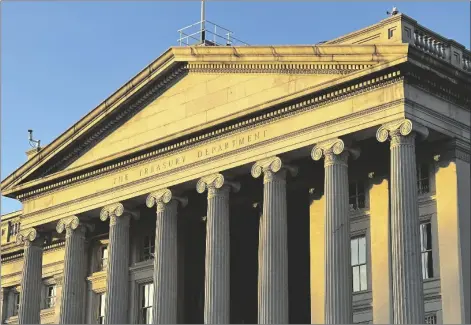  ?? AP PHOTO/JON ELSWICK ?? The Treasury Department is seen near sunset in Washington, on Jan. 18.