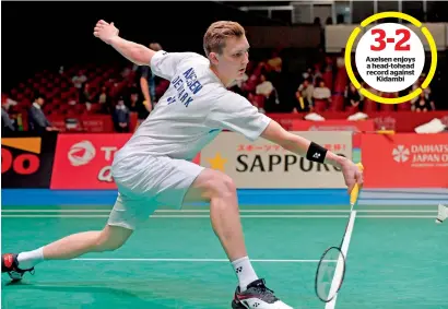  ?? AFP ?? Viktor Axelsen of Denmark hits a return against Srikanth Kidambi of India during their men’s singles quarterfin­al match. —