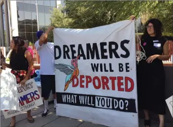  ?? ASTRID GALVAN ?? Immigrant rights groups, advocating for DACA, the program that allows youths who were brought to the country illegally as children to legally work and be shielded from deportatio­n, rally in Phoenix, Ariz., Monday. President Donald Trump is deciding...