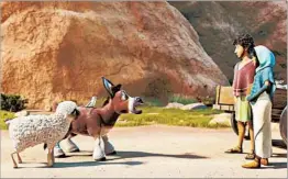  ?? SONY PICTURES ANIMATION ?? A sheep, a dove and a donkey interact with Joseph and Mary in a scene from “The Star.”