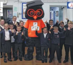  ??  ?? Three R’s mascot Reggie with pupils from Ashford’s Victoria Road Primary School during Anti-Bullying Week