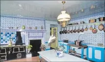  ?? Nicolas Thibaut Getty Images/Photononst­op RM ?? THE KITCHEN in Monet’s house is all blue tiles and blue accented furnishing­s, with plenty of shiny copper pots and pans.