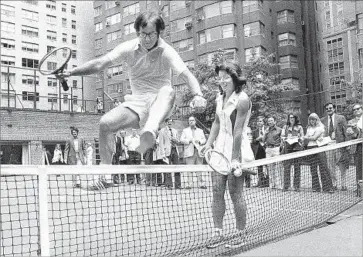  ??  ?? WIMBLEDON champ Billie Jean King holds down net for Bobby Riggs in 1973 “Battle of the Sexes” match.