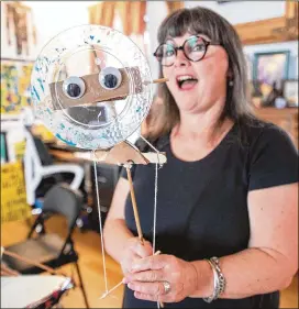  ?? ISADORA PENNINGTON/ATLANTA INTOWN FOR THE AJC ?? Beltline Lantern Parade creator and leader Chantelle Rytter at her home studio in Adair Park as she prepares for this year’s parade.