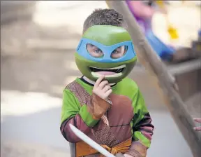  ?? ?? All smiles: Finn White, 4, came as a Ninja Turtle.