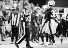  ?? ELISE AMENDOLA THE ASSOCIATED PRESS ?? Sarah Thomas works along the sideline during Sunday’s NFL divisional playoff game in Foxborough, Mass.