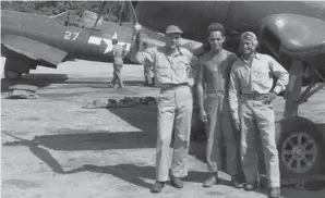 ??  ?? Two pilots from VMF-323 pose for a photo on their base in Okinawa with their plane captain. Lt. F.A. “Hots” Terrill (six kills) is on the left, and Lt. Harold Edelson in on the far right. (Photo by Al Wells)