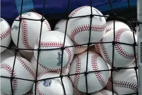  ?? Charlie Riedel / Associated Press ?? With a record number of home runs hit during the 2019 season, revised baseballs will be used and are expected to fly a couple of feet less when hit over 375 feet.