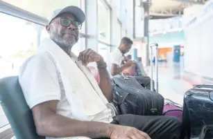  ?? TAYLOR/MULTIMEDIA PHOTO EDITOR PHOTOS BY GLADSTONE ?? Loyton Levy, 69, waits in a hall at the Norman Manley Internatio­nal Airport yesterday. Levy said he would rather be infected with the novel coronaviru­s in Canada than in Jamaica because of the quality of healthcare available.