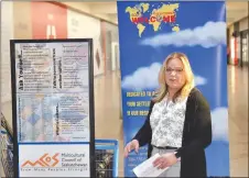  ?? ?? Rebecca Anderson, the community connection­s worker at the Southwest Newcomer Welcome Centre, provides details about the cultural exploratio­n display at the Swift Current Mall, March 21.