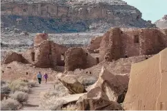  ?? EDDIE MOORE/JOURNAL ?? Visitors walk through Pueblo Bonito at the Chaco Culture National Historical Park in November 2021.