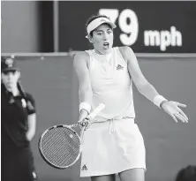  ?? Ben Curtis / Associated Press ?? Spaniard Garbine Muguruza can’t believe she just lost that point, which made her match loss almost incomprehe­nsible.