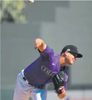  ??  ?? The Rockies’ Peter Lambert delivers a pitch Tuesday against the Cleveland Indians at Salt River Fields at Talking Stick in Scottsdale, Ariz.