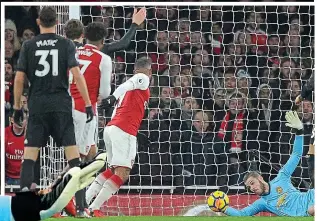  ?? REX ?? Saviour: De Gea’s brilliant double stop denied Lacazette (above) an kept Sanchez at bay when the Chilean seemed certain to score