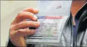  ?? REUTERS FILE ?? A passenger who denied entry into the US shows the cancelled visa in his passport at Dulles Internatio­nal Airport.