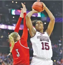  ?? THE ASSOCIATED PRESS ?? Mississipp­i State’s Teaira McCowan shoots over Louisville’s Sam Fuehring during their national semifinal Friday in Columbus, Ohio.