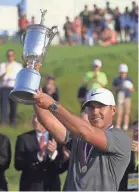  ??  ?? Brooks Koepka shot a final-round 2-under-par 68 Sunday to hold off Tommy Fleetwood by one shot and win the U.S. Open at Shinnecock Hills. TANNEN MAURY/EPA-EFE