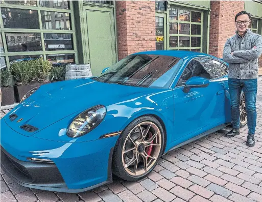  ?? RENEE S. SUEN PHOTOS FOR THE TORONTO STAR ?? Dr. Daniel Sun’s eye-catching 2022 Porsche 911 GT3 is outfitted in striking Shark Blue that he paired with Stain Neodyme wheels.