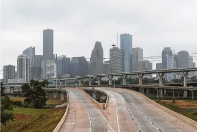  ?? Steve Gonzales / Staff photograph­er ?? The absence of traffic during the coronaviru­s shutdown reduced pollution in Houston. With the economy reopening, both traffic and pollution are making a comeback.