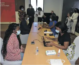  ?? ?? Guimera Junior (red-and-white shirt) became the first Angolan to be enfranchis­ed abroad when she registered at Angola’s consulate-general in Cape Town this week. Photo: Supplied