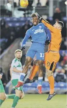  ??  ?? Posh striker Ivan Toney challenges the Plymouth goalkeeper.