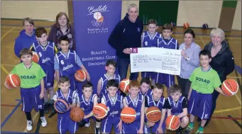  ??  ?? Bullets committee members Maeve Coleman, Ger Mooney, Emmet Nulty and Siobhan Hackett, along with the Bullets Under-12 team, present a cheque for more than €1,200 to Carmel Hancock from SOSAD after running a fundraiser for the charity.