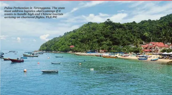  ?? FILE PIC ?? Pulau Perhentian in Terengganu. The state must address logistics shortcomin­gs if it wants to handle high-end Chinese tourists arriving on chartered flights.