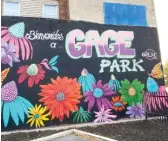  ??  ?? This mural by Mario Mena — head of the Gage Park Mural Project — includes flowers, a butterfly and the welcoming words “Bienvenido­s a Gage Park.”