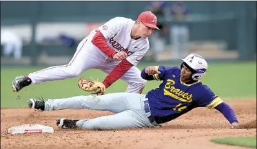  ?? NWA Democrat-Gazette/ANDY SHUPE ?? Arkansas shortstop Jax Biggers, shown tagging out a base runner against Alcorn State on March 14, signed with the Razorbacks after helping lead Cisco (Texas) Junior College to the National Junior College World Series last season.