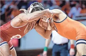 ?? NATHAN J FISH/THE OKLAHOMAN ?? Oklahoma State topped OU for the Cowboys’ 17th straight victory in the Bedlam wrestling dual on Thursday night at Gallagher-Iba Arena.