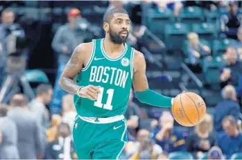  ?? ANDY LYONS/GETTY IMAGES ?? Boston’s Kyrie Irving has scored 30 points or more in three out of the last four games for the Celtics.