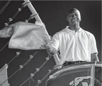  ?? CHUCK BURTON/ASSOCIATED PRESS FILE ?? Charlotte Hornets owner and former NBA legend Michael Jordan practices waving the green flag before a NASCAR All-Star race at Charlotte Motor Speedway. Jordan is starting a new team.