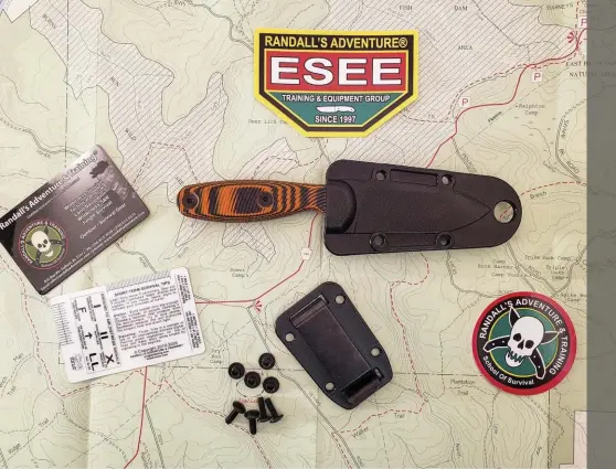  ??  ?? Above: The Xancudo ships with the knife, a polymer sheath, an optional belt clip, and some nice extras, like ESEE stickers and a handy survival card.