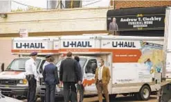  ?? JEFF BACHNER/FOR NEW YORK DAILY NEWS ?? Authoritie­s investigat­e bodies being stored in U-Haul trucks outside Andrew T. Cleckley Funeral Home in Flatlands, Brooklyn, this spring.