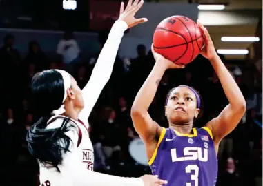  ??  ?? LSU guard Khayla Pointer (3) shoots as Mississipp­i State guard Myah Taylor defends during last year's meeting between the two teams in Starkville, which was won by the Bulldogs 76-56. (Photo by Rogelio V. Solis, AP)