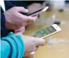  ??  ?? Customers look at iPhone 8 and iPhone 8 Plus phones at an Apple Store in San Francisco.