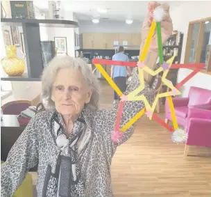  ??  ?? ●●Betty Smith, a resident at Borough Care’s Bruce Lodge home in Offerton, with her decorated star