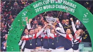  ??  ?? GETTY IMAGES France’s Davis Cup team members celebrate with the Davis Cup trophy after they beat Belgium in the final in Lille, France, on November 26, 2017.