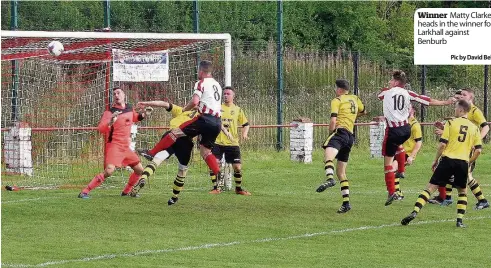  ??  ?? Winner Matty Clarke heads in the winner for Larkhall against Benburb Pic by David Bell)