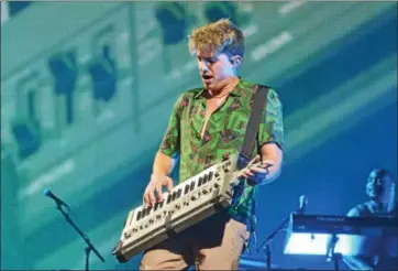  ?? NICHOLAS BUONANNO -- NBUONANNO@TROYRECORD.COM ?? Charlie Puth plays on his keyboard guitar while performing at Saratoga Performing Arts Center Sunday night.