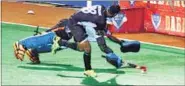  ??  ?? CAG’S Nitin Thimmaiah scores past Western Railway goalkeeper.