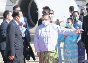  ?? AFP ?? Hun Sen is welcomed by Myanmar’s Foreign Minister Wunna Maung Lwin upon arrival in Nay Pyi Taw yesterday. The Cambodian premier came with 3 million face masks and other medical equipment as a gift for Myanmar’s junta.